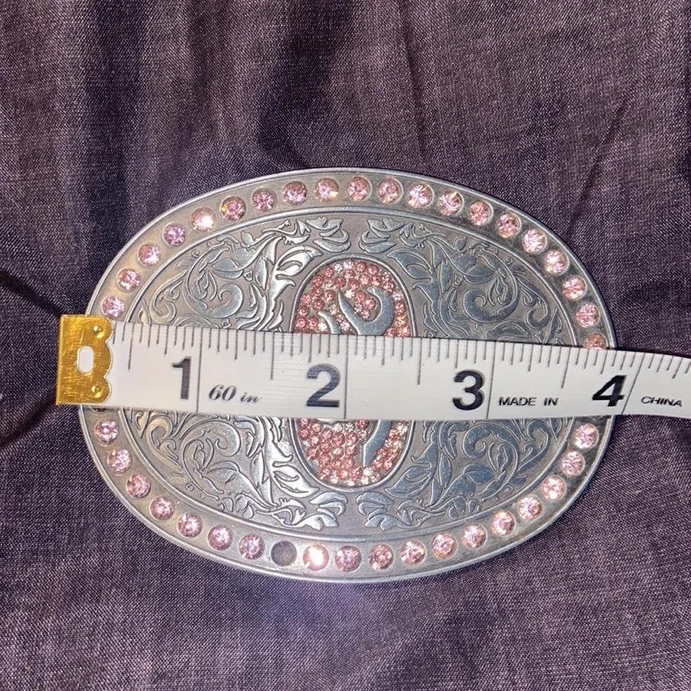 Browning Buck mark silver plated belt buckle with pink rhinestones.